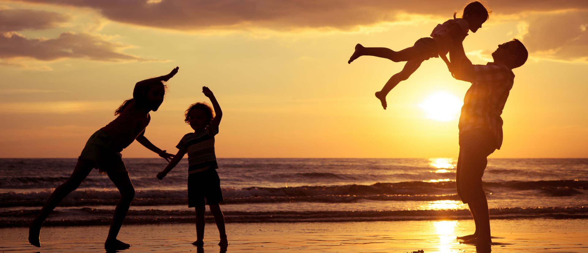 Family Playing on the beach on St George Island - places to stay on st george island